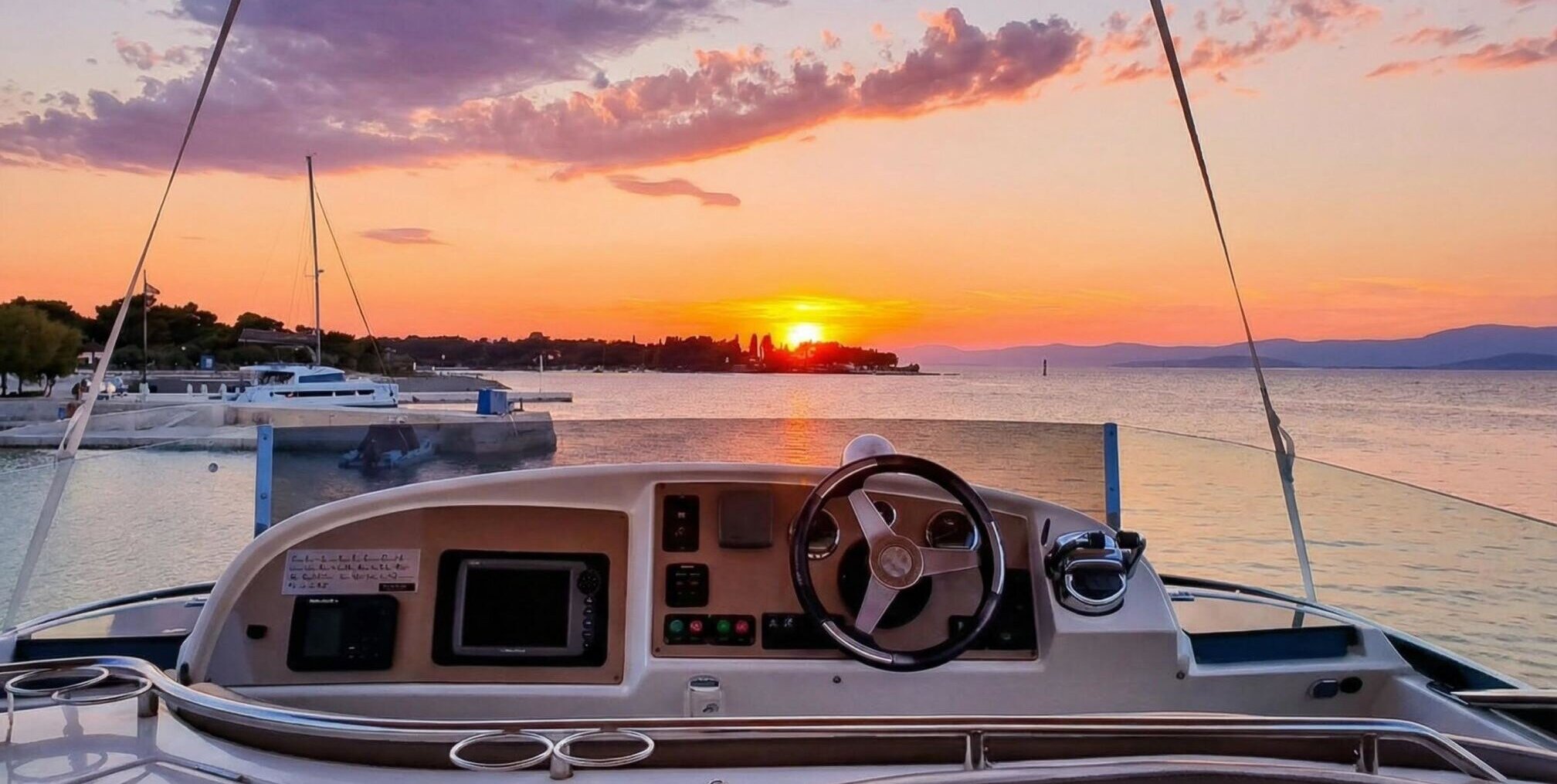 View from a luxury yacht at sunset along the Croatian coast